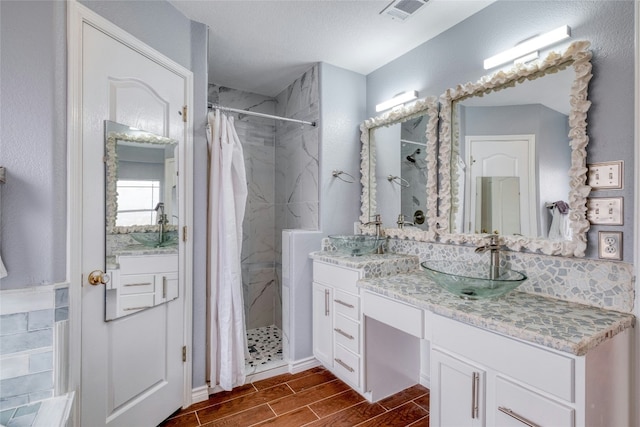 233 Thomas Dr, Martindale, TX 78655 - bathroom with vanity, a shower stall, and wood tiled floors