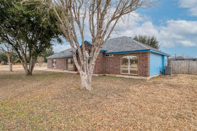 233 Thomas Dr, Martindale, TX 78655 - view of front of property with a shingled roof and brick siding