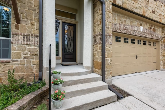 399 Whispering Wind Way, Austin, TX 78737 - doorway to property featuring stone siding, a garage, stucco siding, and driveway