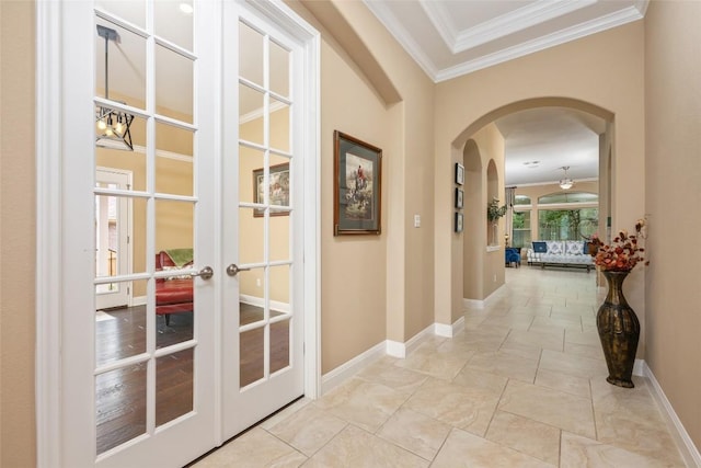 399 Whispering Wind Way, Austin, TX 78737 - hallway with arched walkways, ornamental molding, and french doors
