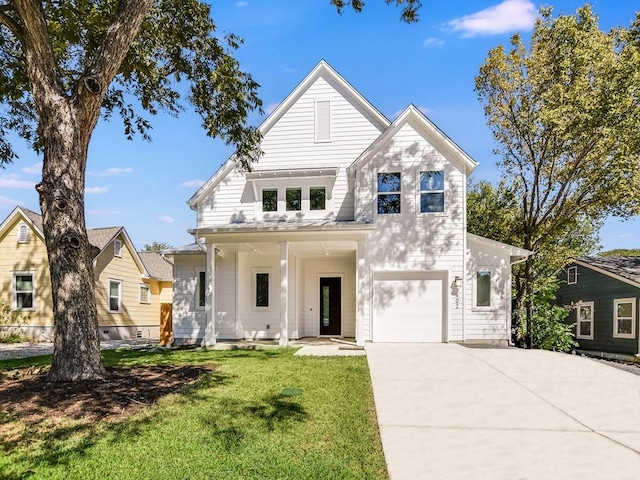402 Zennia St, Austin, TX 78751 - view of front of property with an attached garage, a front lawn, driveway, and a porch