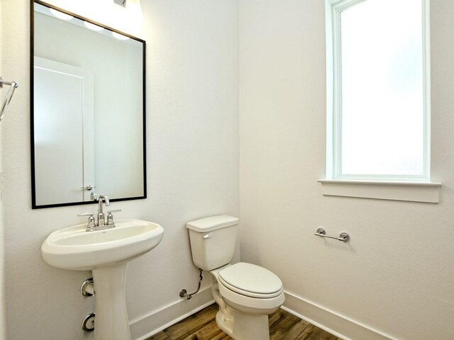 402 Zennia St, Austin, TX 78751 - bathroom with baseboards and wood finished floors
