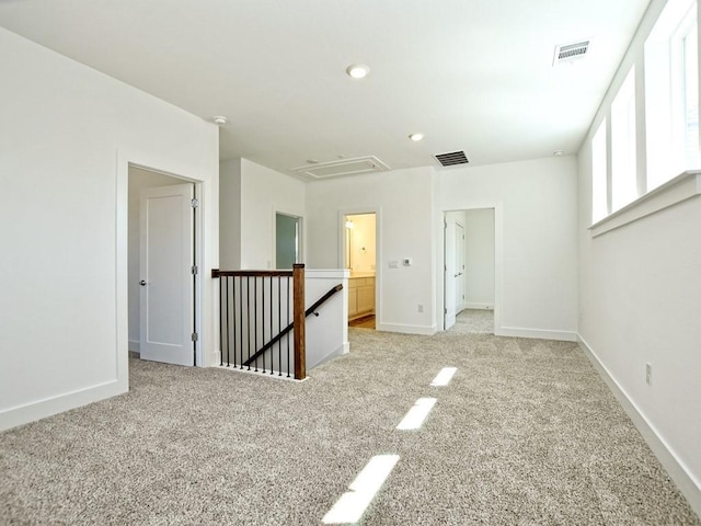 402 Zennia St, Austin, TX 78751 - spare room with attic access, light carpet, and recessed lighting