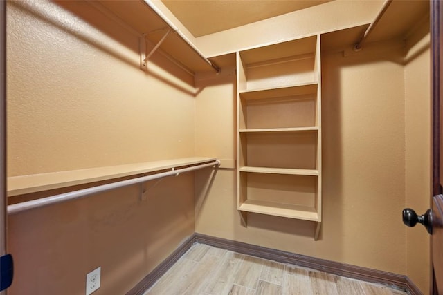 108 Whispering Pines Dr, Bastrop, TX 78602 - walk in closet featuring light wood-type flooring