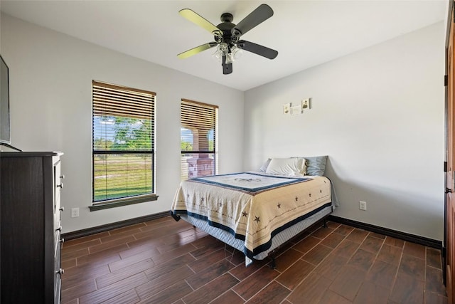 108 Whispering Pines Dr, Bastrop, TX 78602 - bedroom featuring dark wood finished floors and ceiling fan