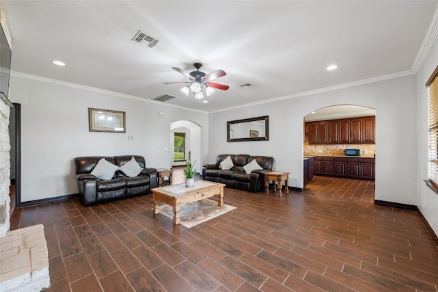 108 Whispering Pines Dr, Bastrop, TX 78602 - living area with arched walkways, ceiling fan, recessed lighting, dark wood-style floors, and ornamental molding