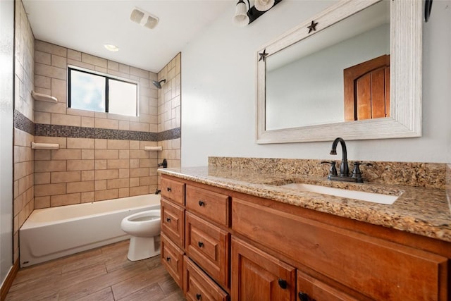108 Whispering Pines Dr, Bastrop, TX 78602 - bathroom featuring vanity, tub / shower combination, and wood finished floors
