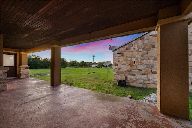 108 Whispering Pines Dr, Bastrop, TX 78602 - patio terrace at dusk with a patio area and a lawn