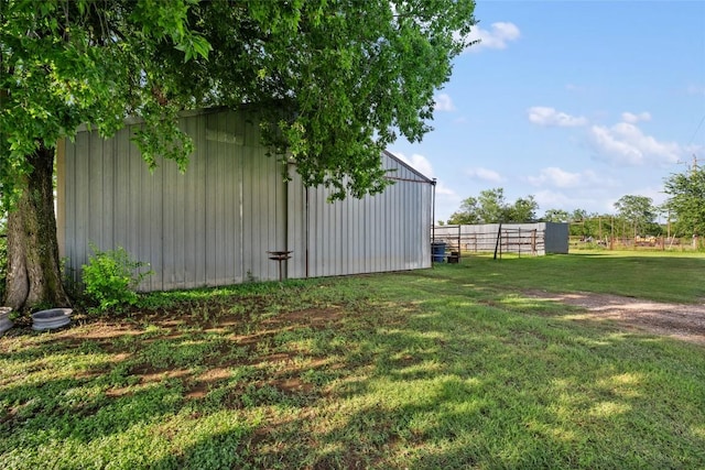 108 Whispering Pines Dr, Bastrop, TX 78602 - view of yard featuring a pole building and an outbuilding