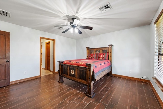 108 Whispering Pines Dr, Bastrop, TX 78602 - bedroom featuring dark wood-type flooring and ceiling fan