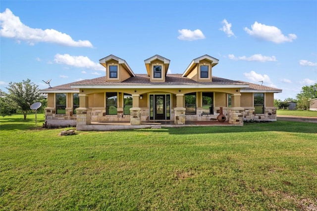108 Whispering Pines Dr, Bastrop, TX 78602 - back of property featuring stone siding, a porch, and a lawn