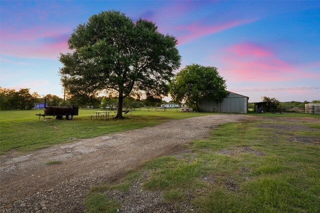 108 Whispering Pines Dr, Bastrop, TX 78602 - view of dirt / gravel driveway with a pole building