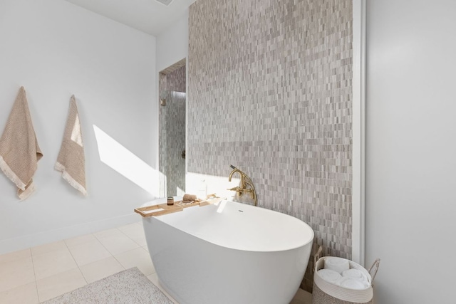 2701 Greenlee Dr, Austin, TX 78703 - full bath featuring a freestanding bath, tile walls, and tile patterned floors