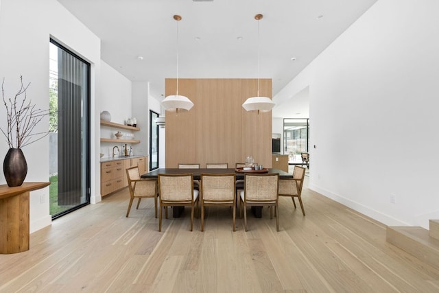 2701 Greenlee Dr, Austin, TX 78703 - dining area with light wood-style flooring and plenty of natural light