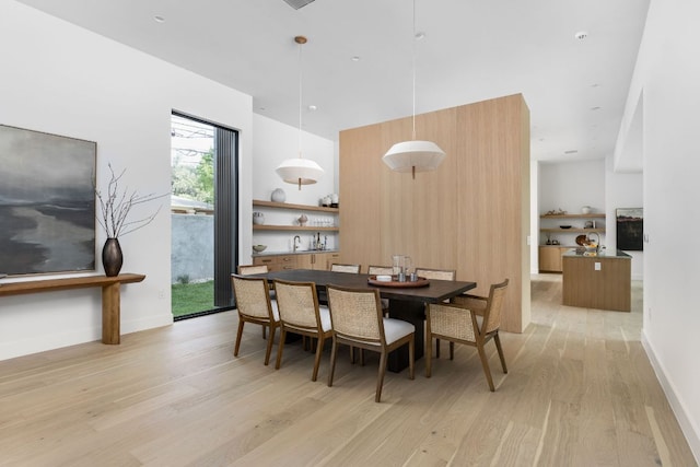 2701 Greenlee Dr, Austin, TX 78703 - dining area with light wood-style flooring and a high ceiling