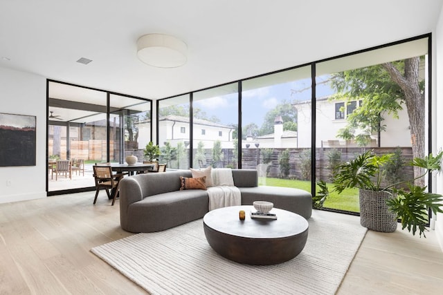2701 Greenlee Dr, Austin, TX 78703 - living room featuring floor to ceiling windows and wood finished floors