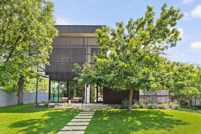 2701 Greenlee Dr, Austin, TX 78703 - rear view of house featuring a lawn and a patio