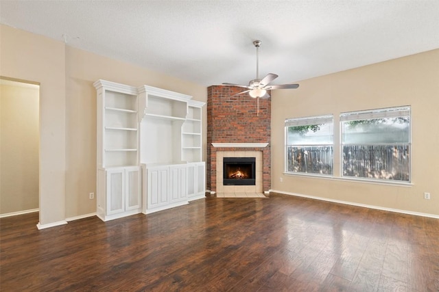 1008 NE Chippewa St, Round Rock, TX 78665 - unfurnished living room with a ceiling fan, wood finished floors, and a brick fireplace