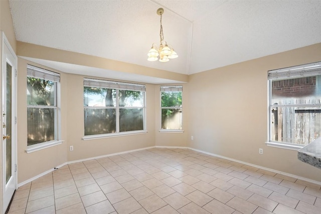 1008 NE Chippewa St, Round Rock, TX 78665 - spare room with a chandelier, healthy amount of natural light, light tile patterned floors, and vaulted ceiling