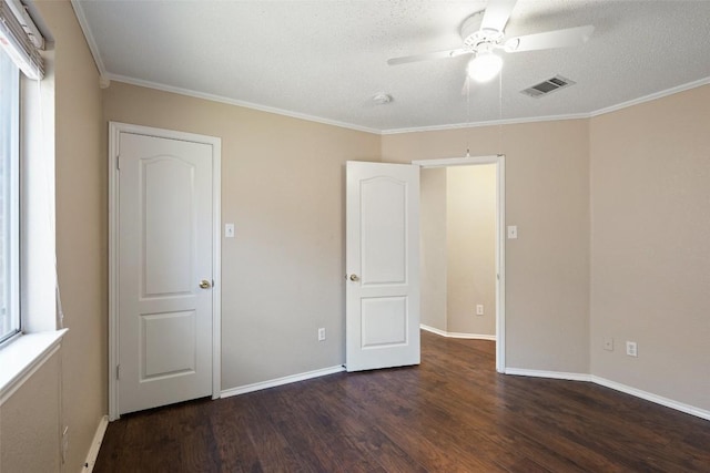 1008 NE Chippewa St, Round Rock, TX 78665 - unfurnished bedroom with dark wood-style floors, crown molding, a textured ceiling, and a ceiling fan