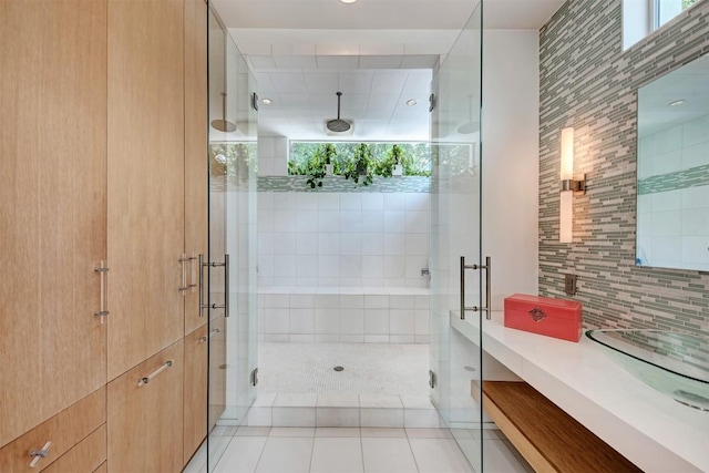 2505 Stratford Dr, Austin, TX 78746 - bathroom with vanity, a shower stall, backsplash, and tile patterned floors