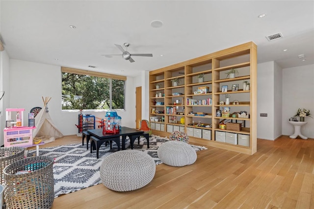 2505 Stratford Dr, Austin, TX 78746 - playroom featuring light wood-style floors, ceiling fan, and recessed lighting