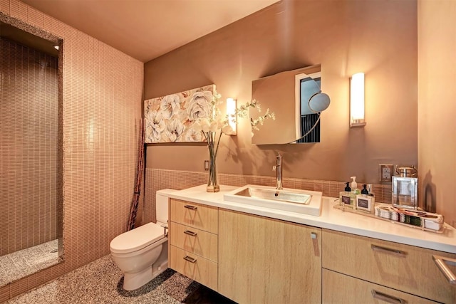 2505 Stratford Dr, Austin, TX 78746 - bathroom featuring vanity, a shower, and tile walls