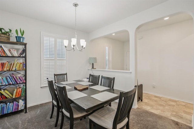 657 Bailey Park Dr, Jarrell, TX 76537 - carpeted dining area featuring a chandelier and baseboards