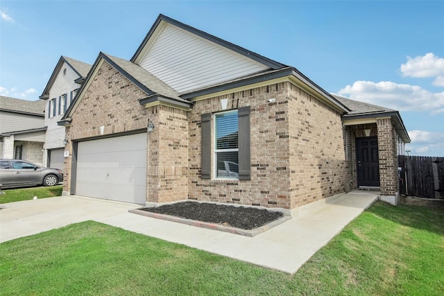 657 Bailey Park Dr, Jarrell, TX 76537 - view of front of home with brick siding, a garage, and concrete driveway