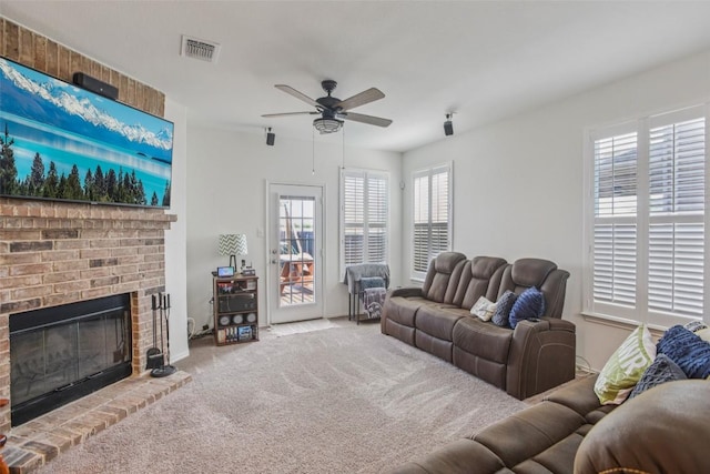 657 Bailey Park Dr, Jarrell, TX 76537 - living area with a ceiling fan, carpet, and a fireplace