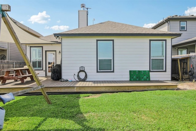 657 Bailey Park Dr, Jarrell, TX 76537 - back of property with a wooden deck, a chimney, and a shingled roof