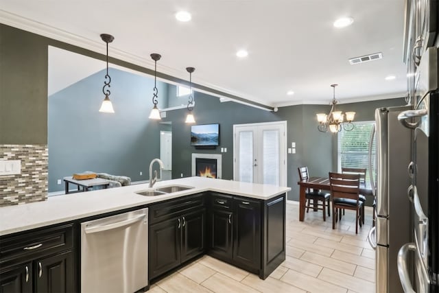 11611 Quarter Horse Trl, Austin, TX 78750 - kitchen featuring stainless steel appliances, light countertops, dark cabinets, backsplash, and ornamental molding