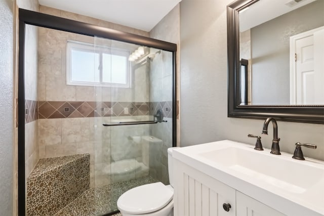 11611 Quarter Horse Trl, Austin, TX 78750 - full bathroom featuring vanity, a stall shower, and a textured wall