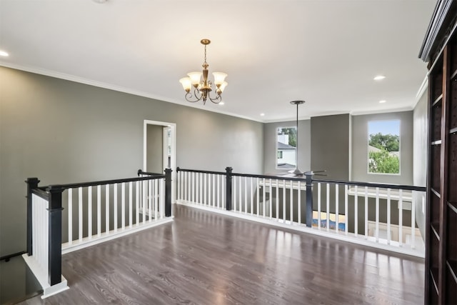 11611 Quarter Horse Trl, Austin, TX 78750 - empty room with crown molding, wood finished floors, recessed lighting, and a chandelier
