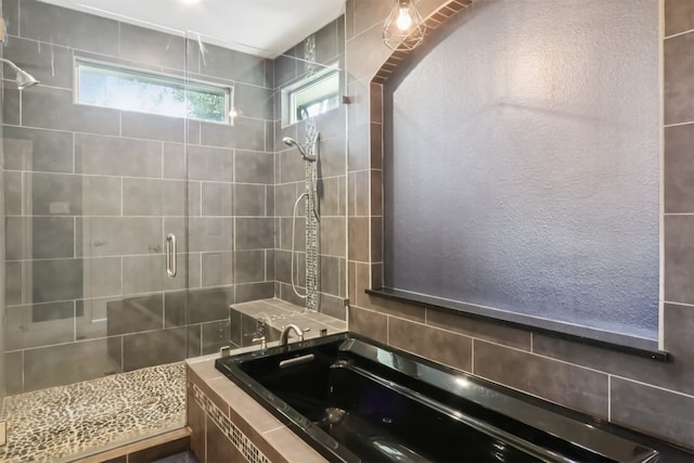 11611 Quarter Horse Trl, Austin, TX 78750 - full bathroom featuring a shower stall and decorative backsplash