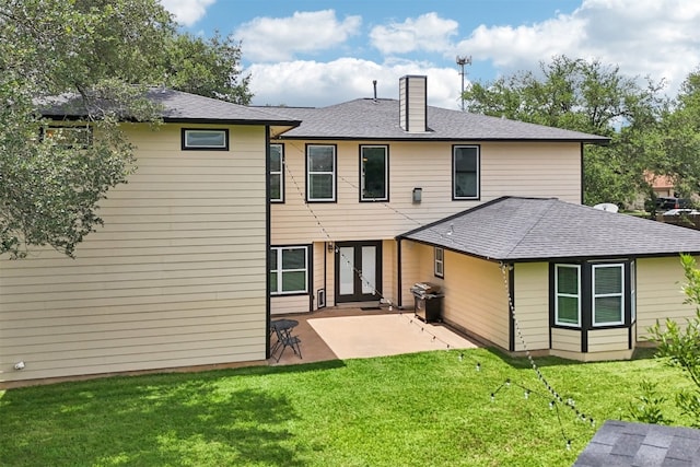 11611 Quarter Horse Trl, Austin, TX 78750 - rear view of property featuring a chimney, a patio area, a yard, french doors, and a shingled roof