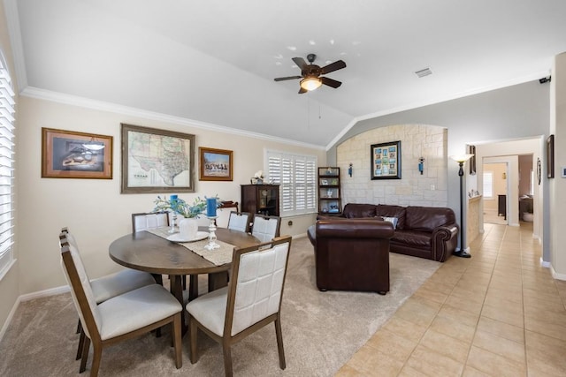 313 Polo Pony, Liberty Hill, TX 78642 - dining area featuring ceiling fan, vaulted ceiling, crown molding, light colored carpet, and light tile patterned floors