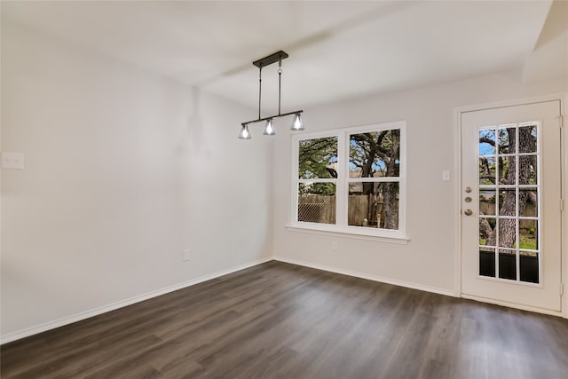 6900 Tesoro Trl, Austin, TX 78729 - unfurnished dining area with dark wood finished floors and healthy amount of natural light