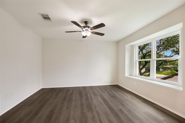6900 Tesoro Trl, Austin, TX 78729 - spare room with dark wood-style floors and ceiling fan