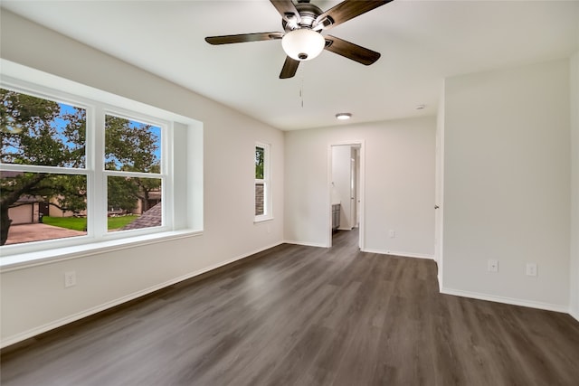 6900 Tesoro Trl, Austin, TX 78729 - spare room featuring dark wood-type flooring and ceiling fan
