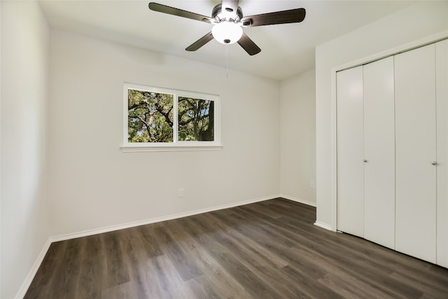 6900 Tesoro Trl, Austin, TX 78729 - unfurnished bedroom featuring dark wood-style flooring, a closet, and ceiling fan