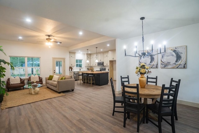 118 Kipapa Ct, Bastrop, TX 78602 - dining space with dark wood-style floors, a chandelier, a ceiling fan, and recessed lighting