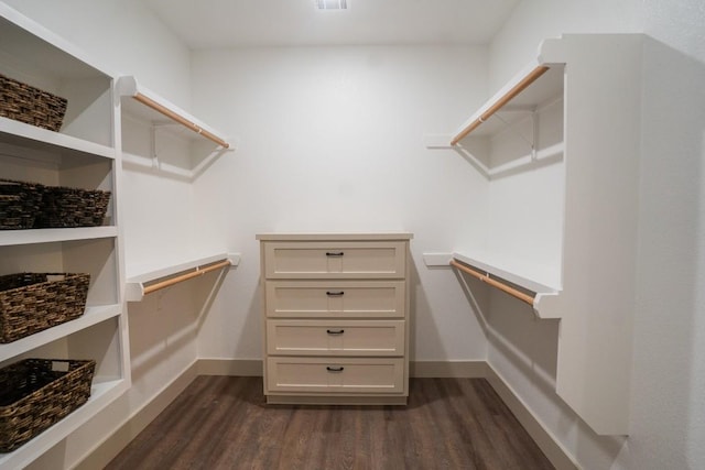 118 Kipapa Ct, Bastrop, TX 78602 - walk in closet featuring dark wood-style floors