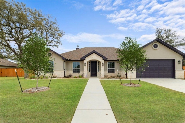 4121 Turning Leaf Dr, Nolanville, TX 76559 - ranch-style house with an attached garage, stucco siding, concrete driveway, stone siding, and a shingled roof