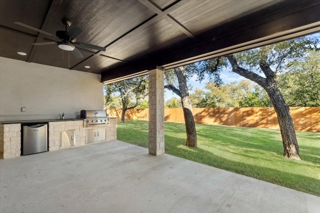 4121 Turning Leaf Dr, Nolanville, TX 76559 - fenced backyard featuring a ceiling fan, an outdoor kitchen, and a patio