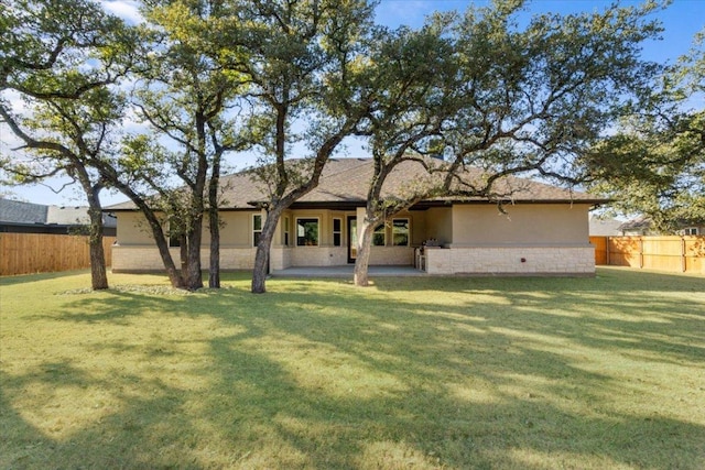 4121 Turning Leaf Dr, Nolanville, TX 76559 - back of house with stucco siding and a patio