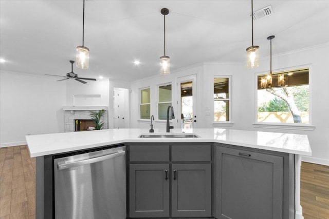 4121 Turning Leaf Dr, Nolanville, TX 76559 - kitchen with stainless steel dishwasher, gray cabinets, crown molding, light countertops, and ceiling fan