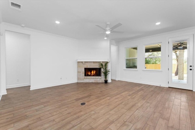4113 Turning Leaf Dr, Nolanville, TX 76559 - unfurnished living room featuring ceiling fan, crown molding, wood finished floors, a fireplace, and recessed lighting