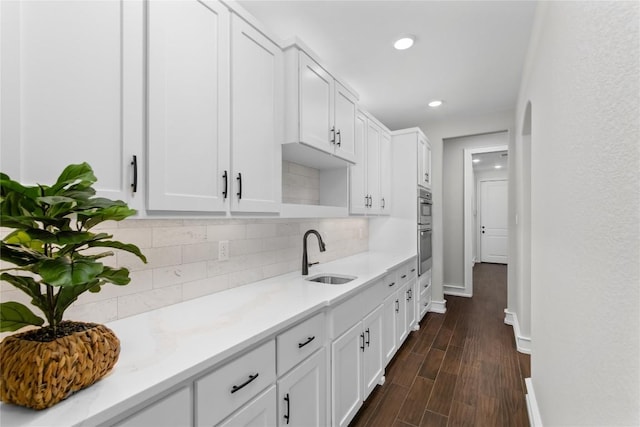 7026 Troyan, Temple, TX 76502 - kitchen with double oven, white cabinetry, decorative backsplash, and recessed lighting