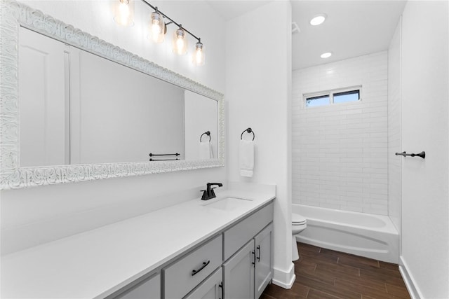 7026 Troyan, Temple, TX 76502 - bathroom featuring vanity, wood finished floors, bathing tub / shower combination, and recessed lighting